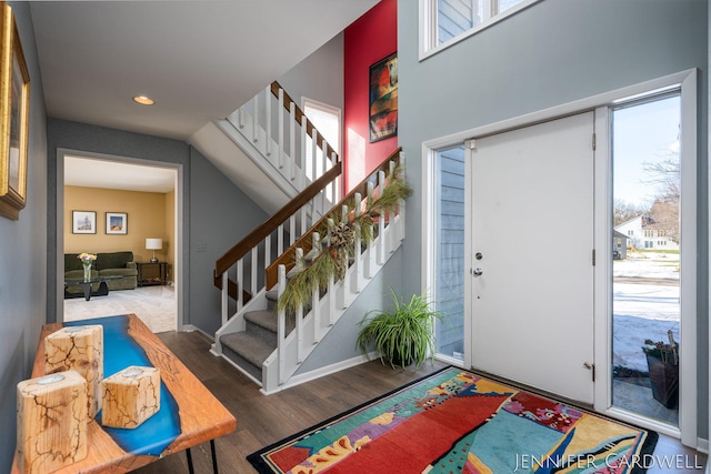 entryway featuring stairs, baseboards, wood finished floors, and recessed lighting