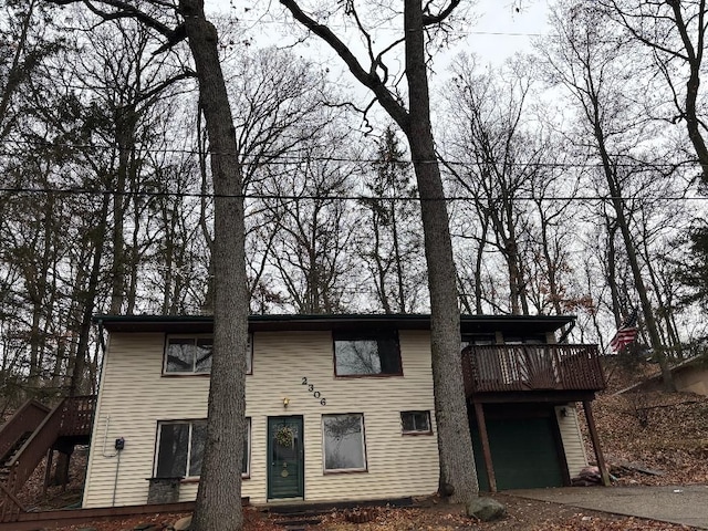 view of front of house with a garage and stairs