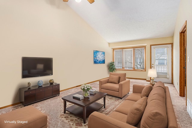 living room featuring high vaulted ceiling, carpet flooring, a ceiling fan, and baseboards