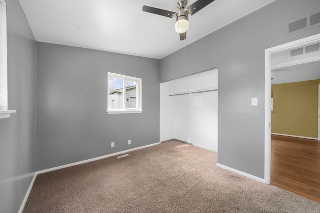 unfurnished bedroom featuring visible vents, carpet floors, and baseboards