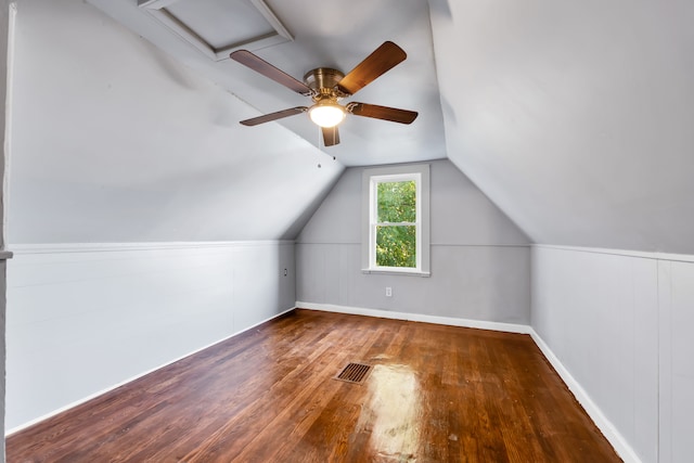 bonus room with visible vents, vaulted ceiling, and wood finished floors