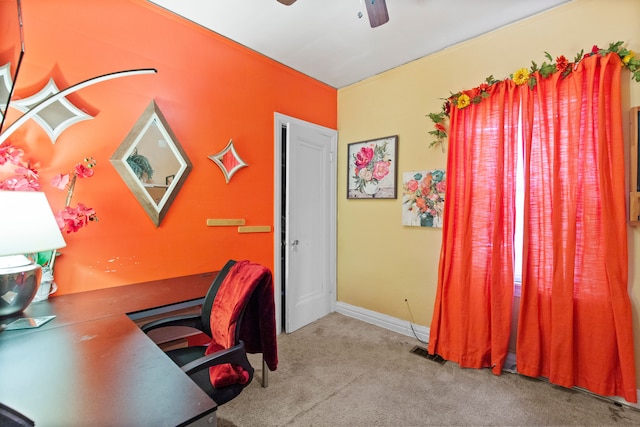 office featuring visible vents, carpet floors, baseboards, and ceiling fan