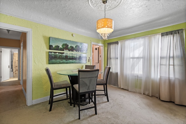 dining space featuring carpet flooring, a textured ceiling, an inviting chandelier, and a textured wall