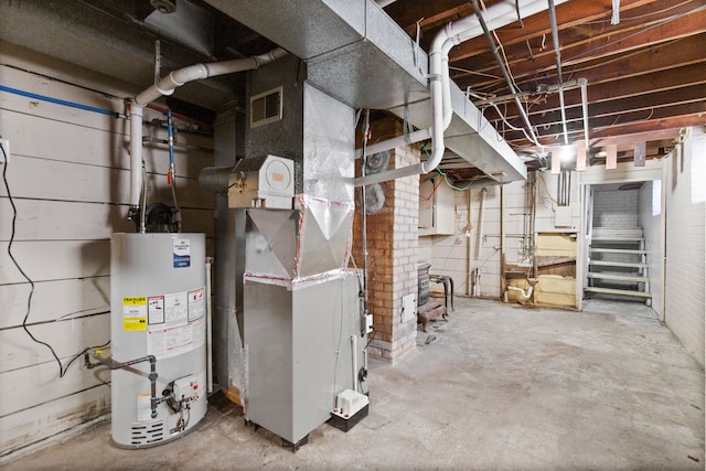 utility room featuring visible vents and water heater