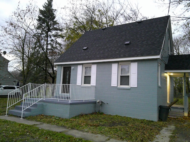 view of front of home featuring a shingled roof