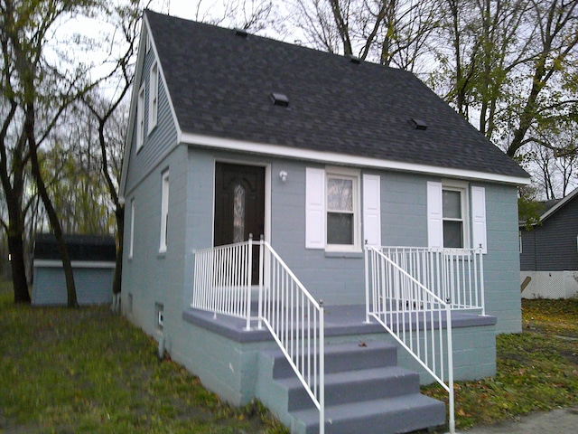 view of front of property with roof with shingles