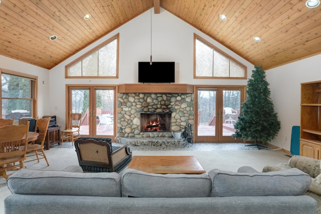 living room featuring high vaulted ceiling, carpet, french doors, and a healthy amount of sunlight