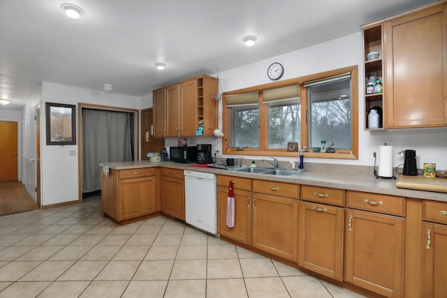 kitchen featuring a peninsula, white dishwasher, light countertops, open shelves, and a sink