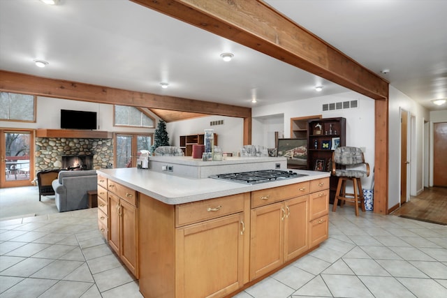 kitchen featuring open floor plan, visible vents, and plenty of natural light