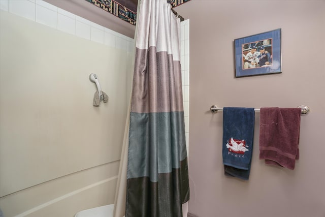 full bathroom with a shower with shower curtain