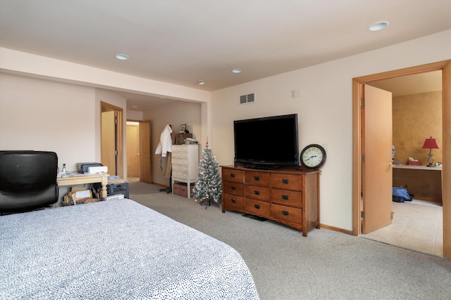 bedroom with light carpet, baseboards, visible vents, and recessed lighting