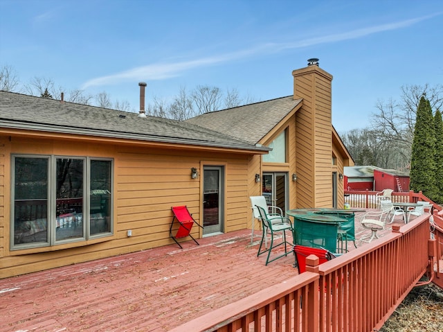 deck with outdoor dining space