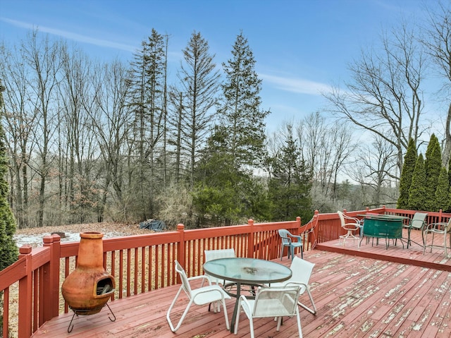 deck with outdoor dining area