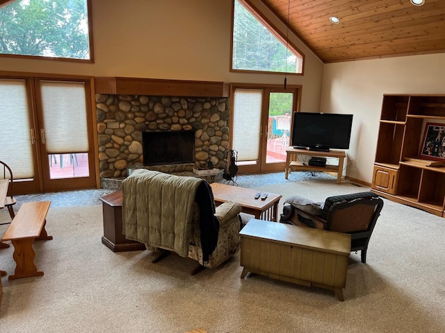 living room with french doors, wooden ceiling, carpet flooring, a stone fireplace, and high vaulted ceiling