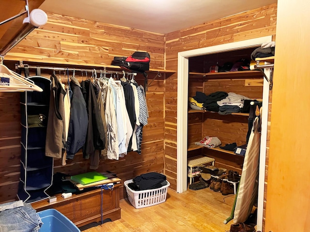 walk in closet featuring wood finished floors