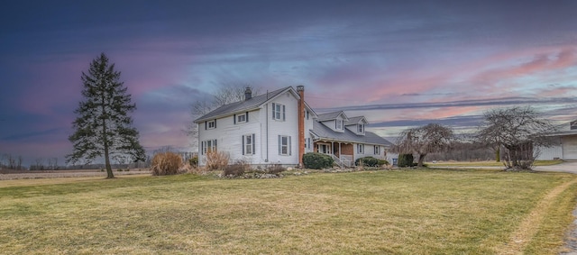 view of front of home with a yard