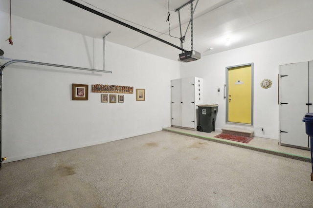 garage featuring baseboards and a garage door opener