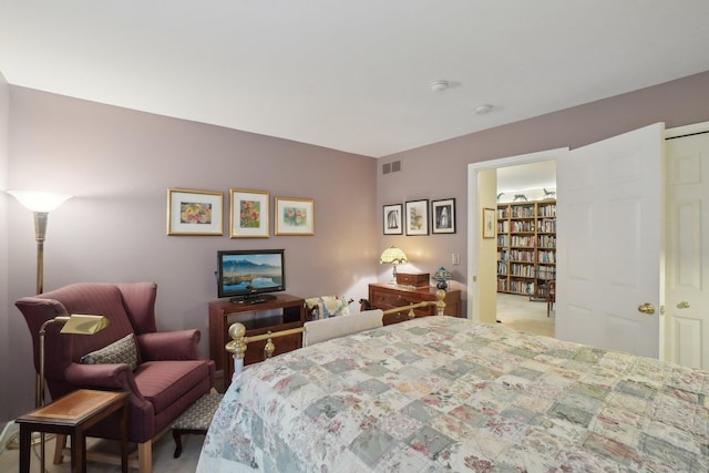 bedroom with carpet floors and visible vents