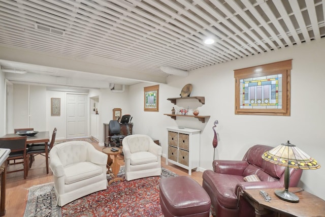 living room with visible vents and wood finished floors