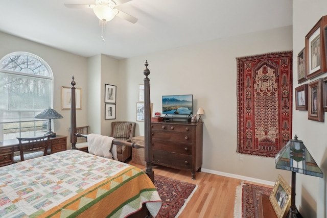 bedroom featuring light wood-style floors, ceiling fan, and baseboards