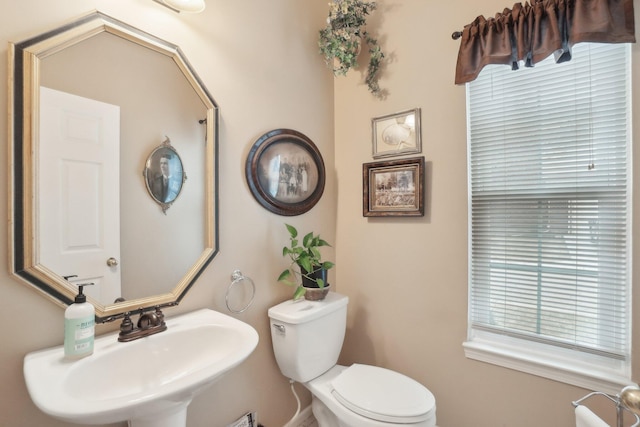 bathroom featuring toilet and a sink