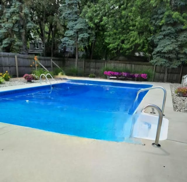 view of swimming pool with a fenced in pool, a patio area, and a fenced backyard