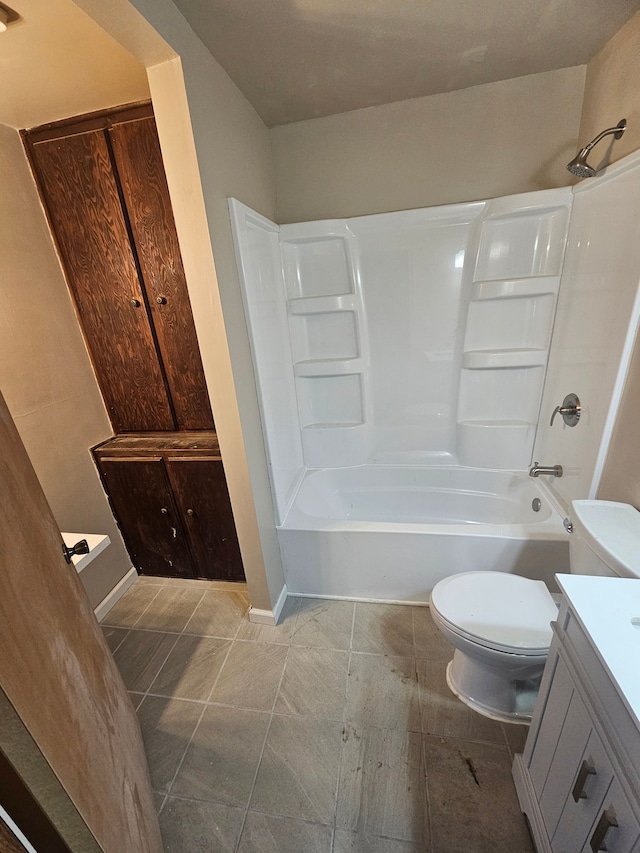 bathroom with toilet, baseboards, tub / shower combination, and vanity