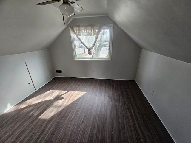 bonus room with vaulted ceiling, ceiling fan, wood finished floors, and visible vents