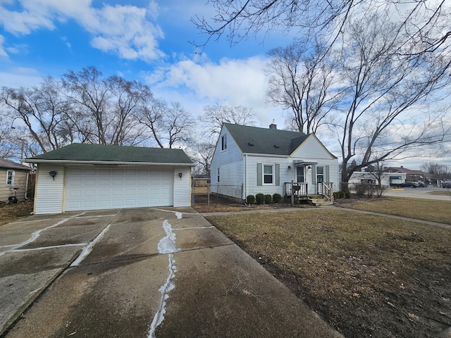 view of front of home featuring a garage, a chimney, fence, and an outdoor structure