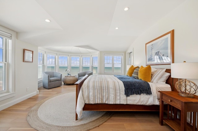 bedroom with baseboards, light wood finished floors, and recessed lighting