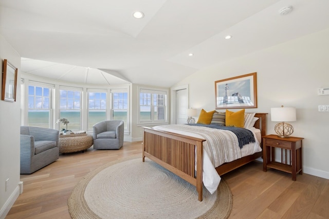 bedroom with recessed lighting, a water view, vaulted ceiling, light wood-type flooring, and baseboards