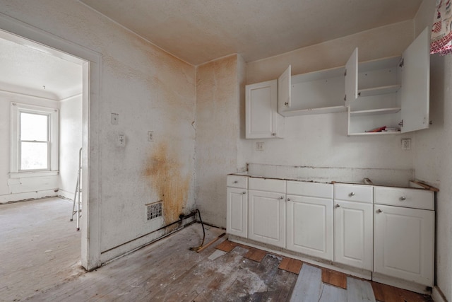 kitchen with open shelves and white cabinetry