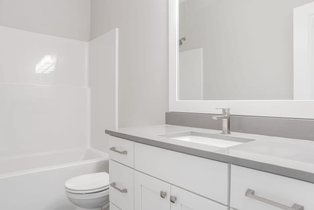 bathroom with toilet, shower / bath combination, and vanity