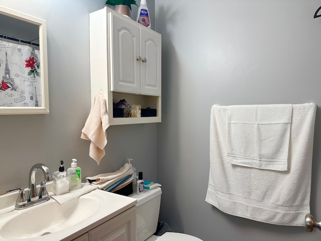 bathroom with vanity and toilet