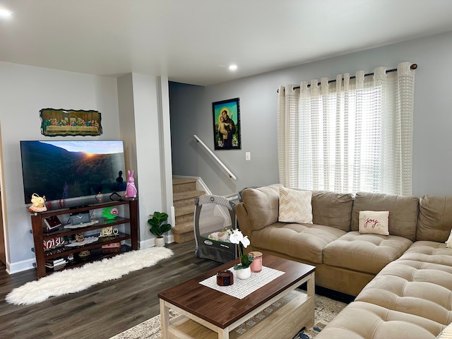 living area with stairway, recessed lighting, wood finished floors, and baseboards