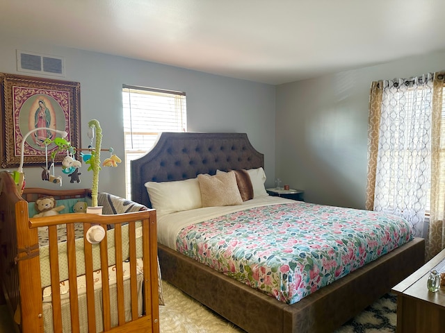 bedroom featuring visible vents