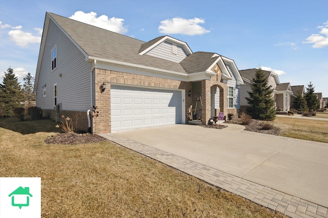 view of front of house with a front lawn, a garage, brick siding, and driveway