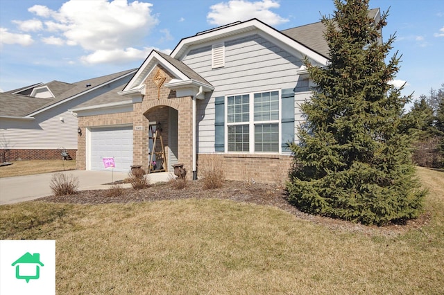 view of front facade featuring brick siding, an attached garage, driveway, and a front yard