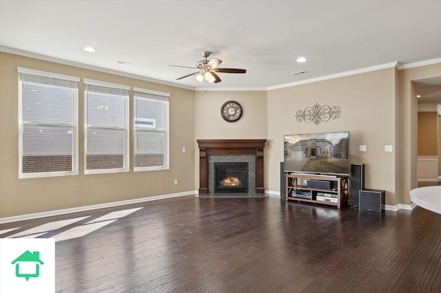 living area with crown molding, wood finished floors, visible vents, and baseboards