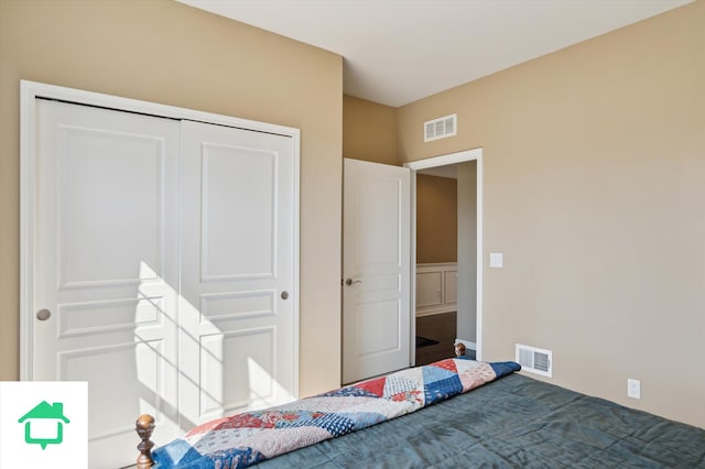 unfurnished bedroom with a closet and visible vents