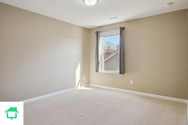 unfurnished room featuring visible vents, baseboards, and carpet