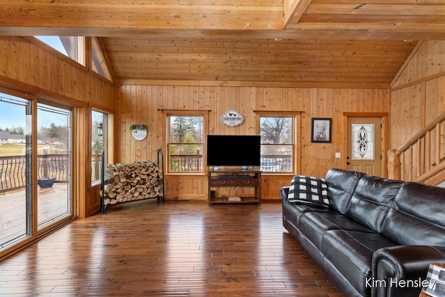 unfurnished living room featuring vaulted ceiling, wooden ceiling, dark wood-style floors, and stairs