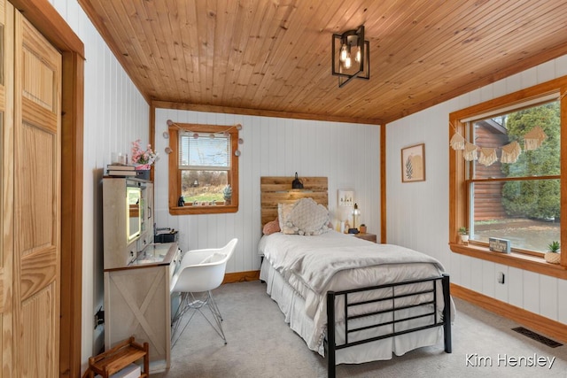 bedroom featuring multiple windows, visible vents, and carpet flooring