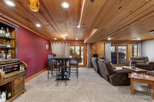 carpeted living area with baseboards, wood ceiling, and recessed lighting