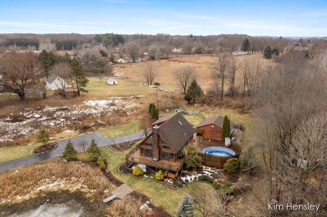 birds eye view of property with a rural view