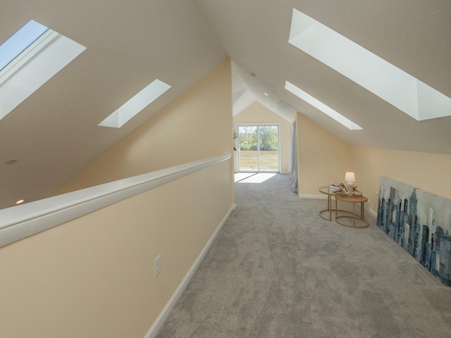 bonus room with carpet, lofted ceiling, and baseboards