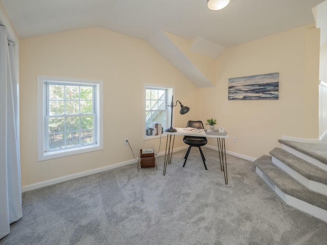 home office with carpet, vaulted ceiling, and baseboards