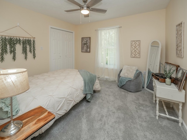 bedroom with a ceiling fan, arched walkways, a closet, and carpet flooring