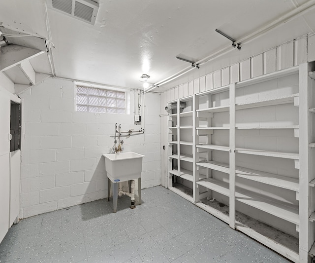 basement with visible vents and tile patterned floors