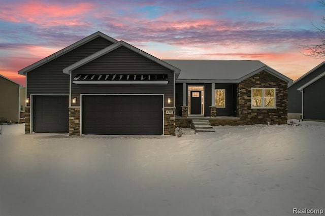 view of front of house with a garage, stone siding, and a porch